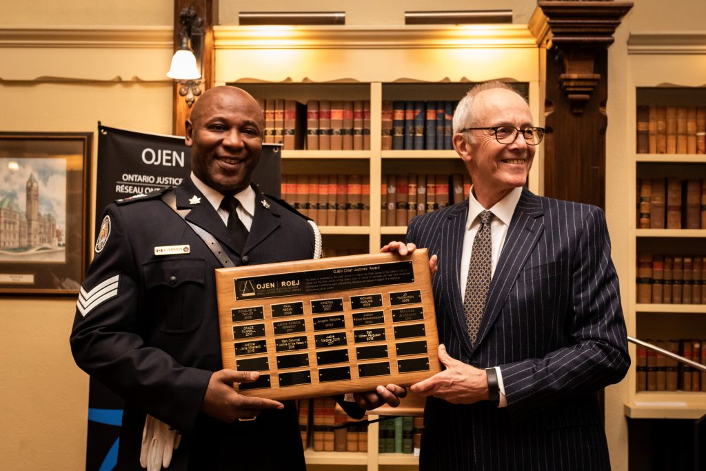 Sergeant Milton Ferguson receiving the Chief Justices' Award presented by the Honourable George R. Strathy